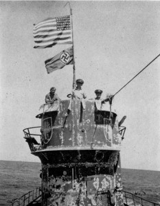 U.S. Naval Officers on the submarine’s conning tower. Photo by USN (June 1944). PD-US Government. Wikimedia Commons.